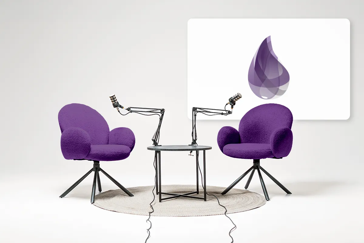 Podcast studio with two purple armchairs, microphones and the Elixir logo on a screen